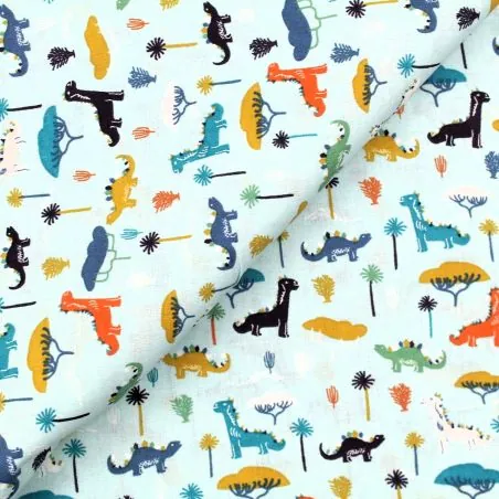 Tissu coton bleu ciel imprimé dinosaure