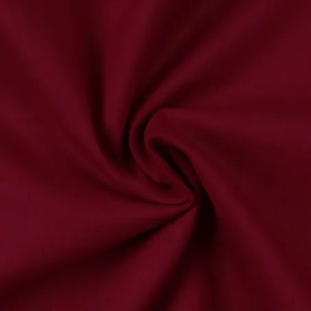 Tissu coton uni satiné de couleur bordeaux