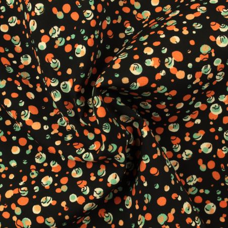 Tissu noir en viscose imprimé bulles orange, blanc et bleu