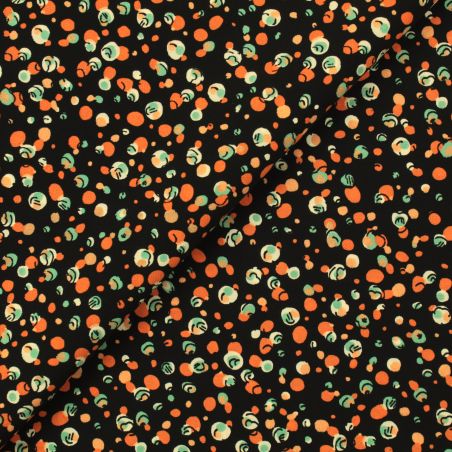 Tissu noir en viscose imprimé bulles orange, blanc et bleu